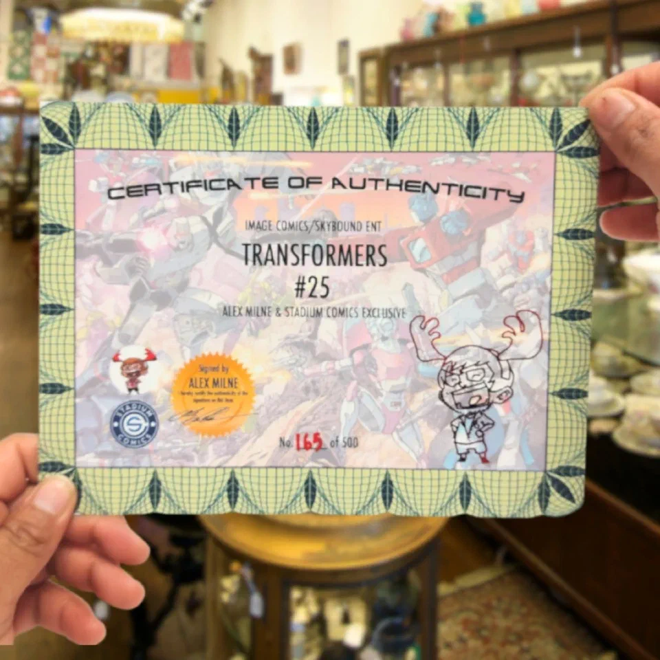 A printed, numbered certificate of authenticity held up in two hands