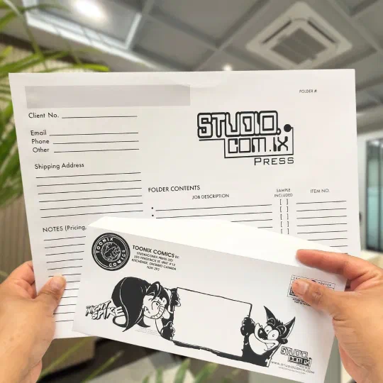 A printed job folder and a branded, addressed envelope held in two hands