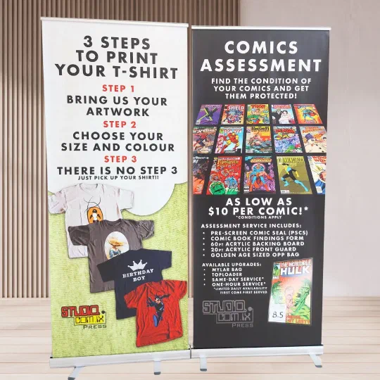 Two retractable banner stands printed for Studiocomix Press